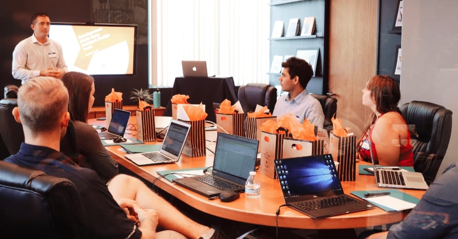 Group of workers sitting around a table in a meeting