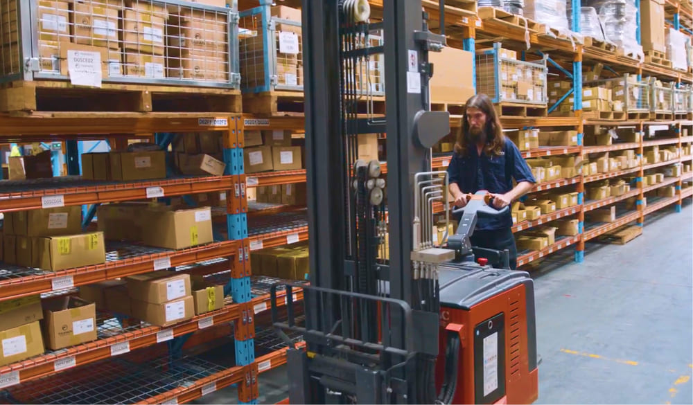 Taipan worker with forklift