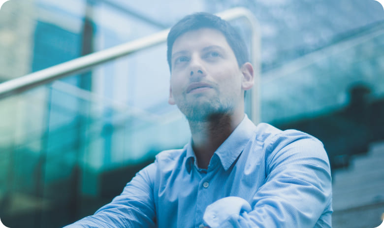 Corporate worker looking through glass