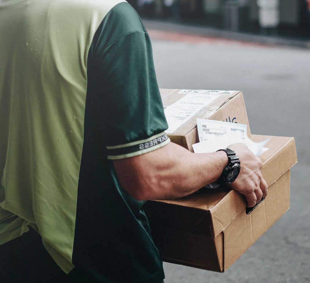 Delivery man carrying boxes