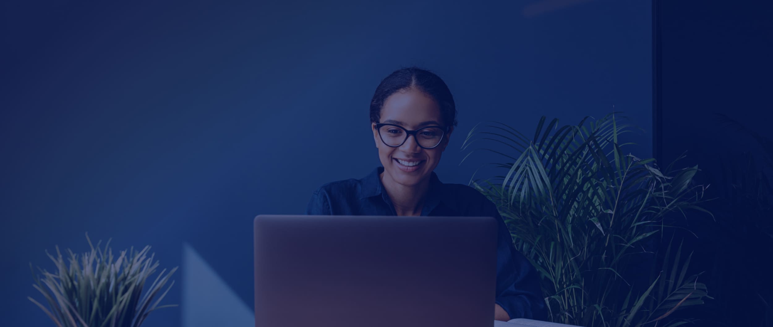 Girl on her laptop with glasses