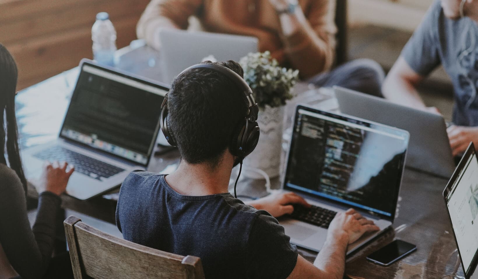 Man at laptop with headphones