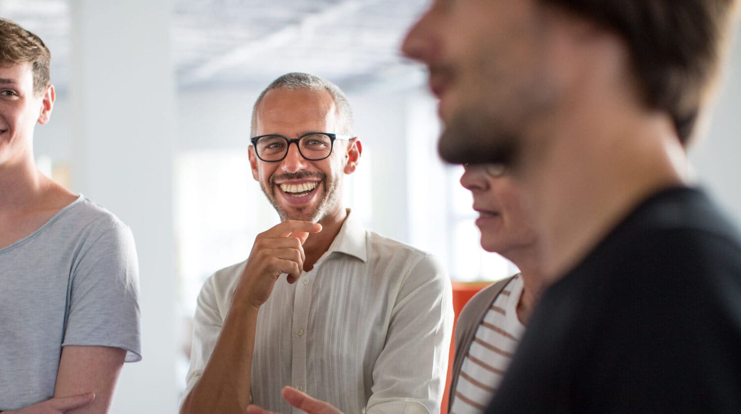 Man with glasses smiling