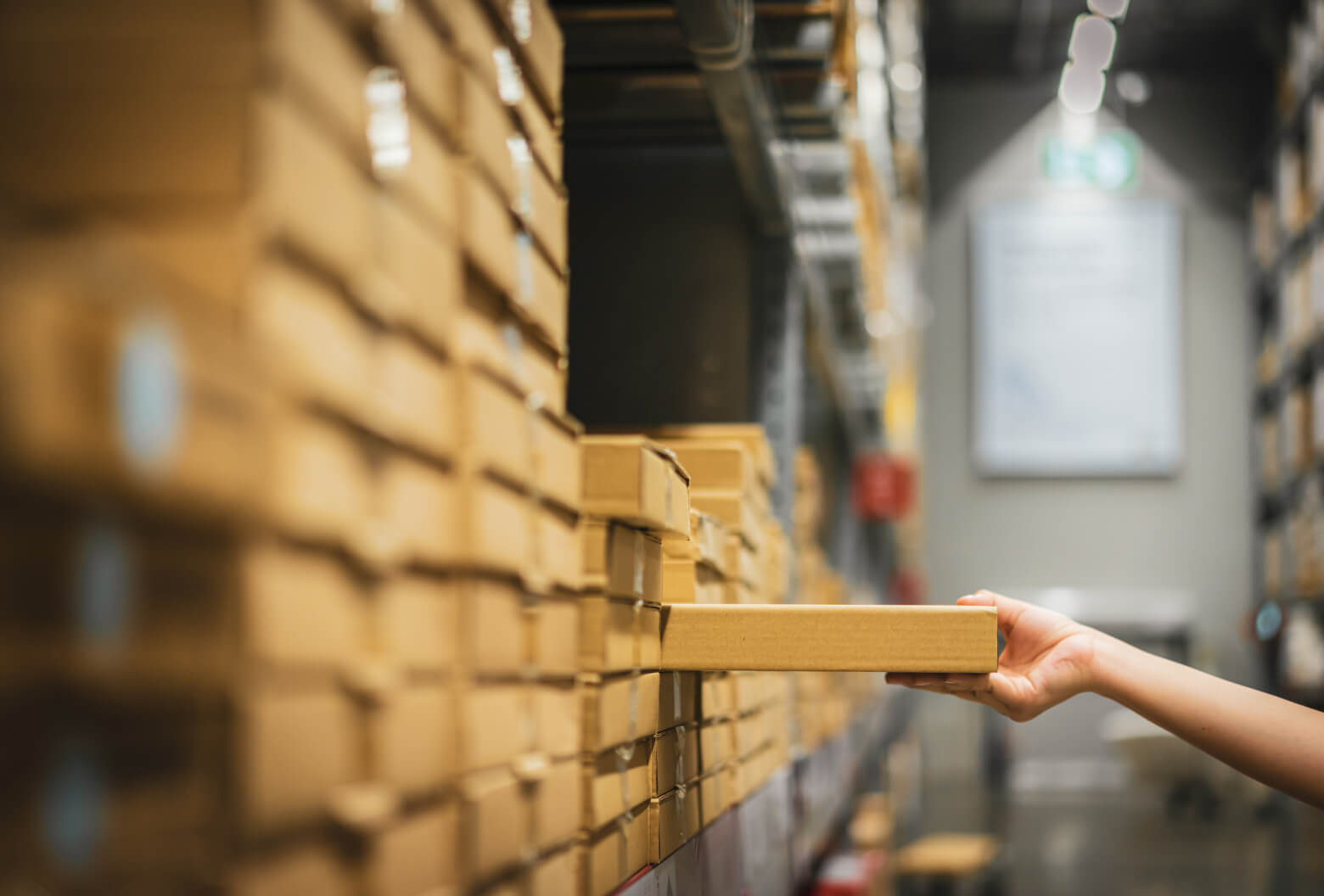 Picking out a box from a warehouse shelf