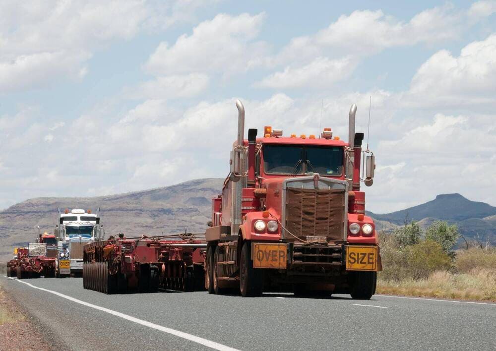 2 trucks on a highway