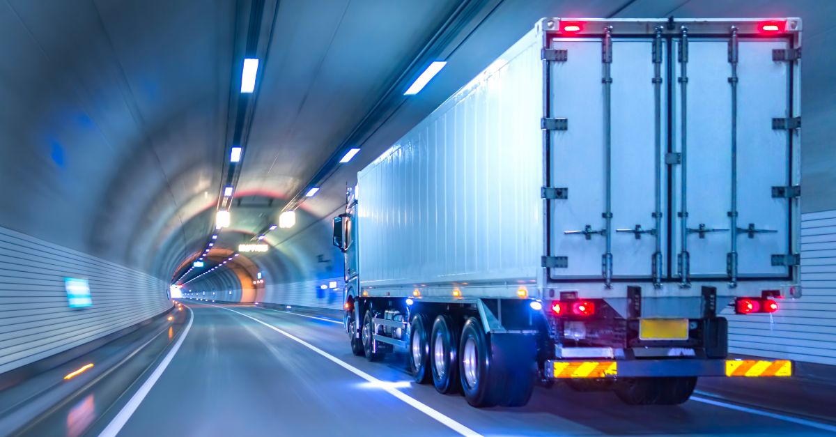 Truck driving in a tunnel with lights