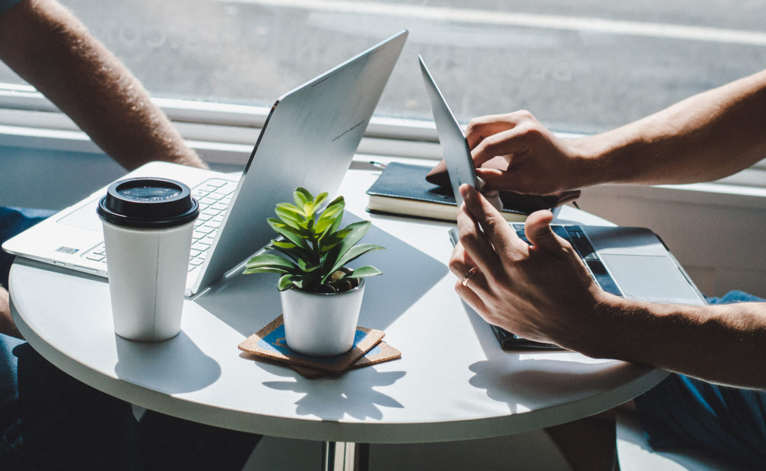 Two laptops at a table