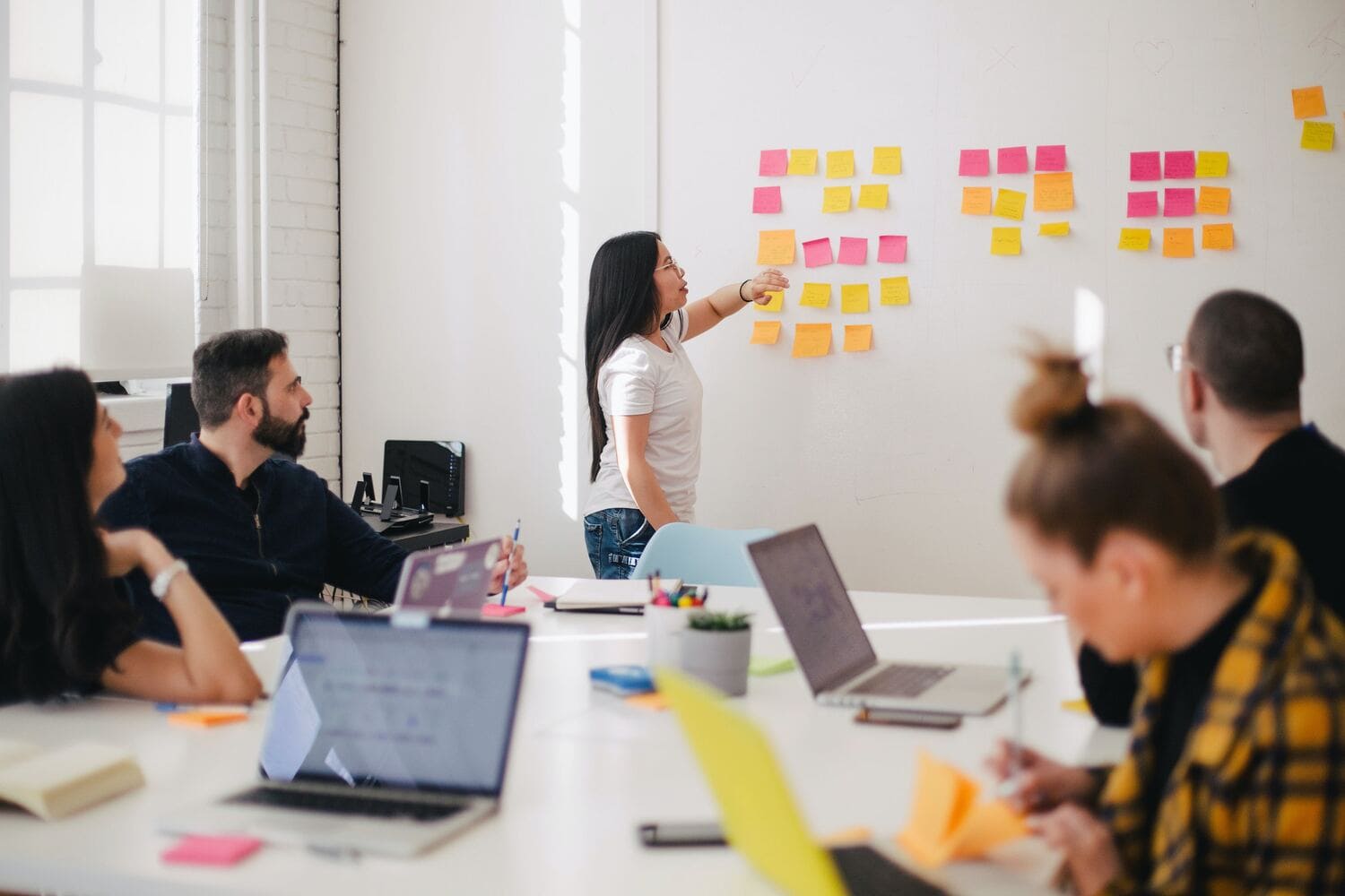 Woman with a whiteboard and sticky notes