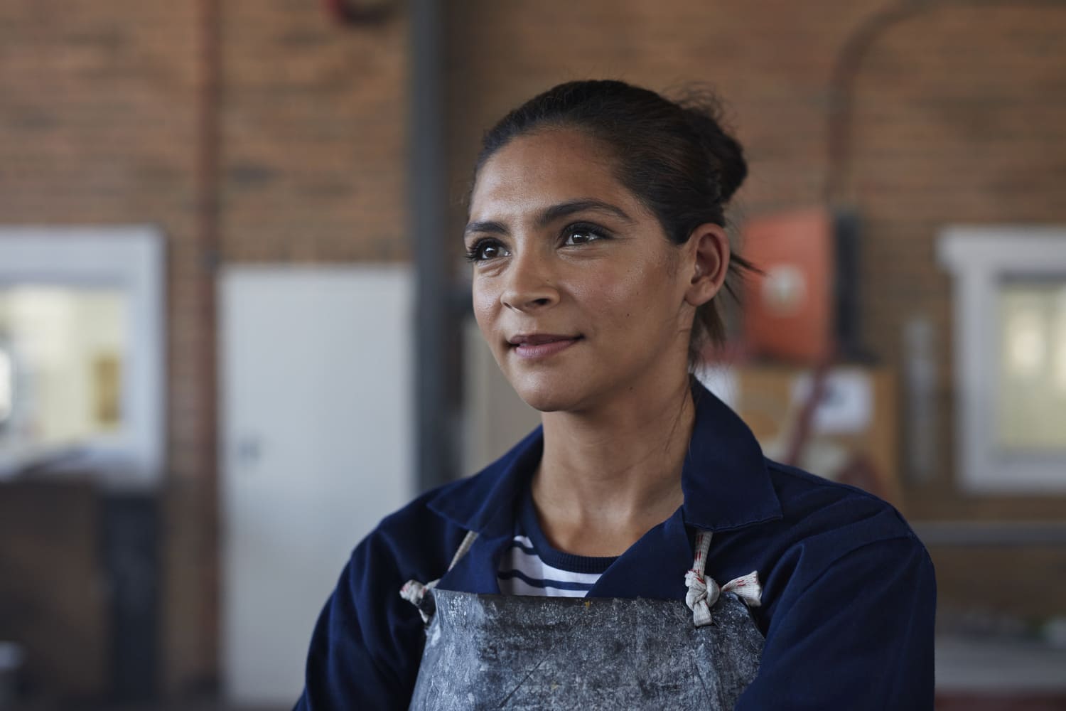 Woman with apron smiling