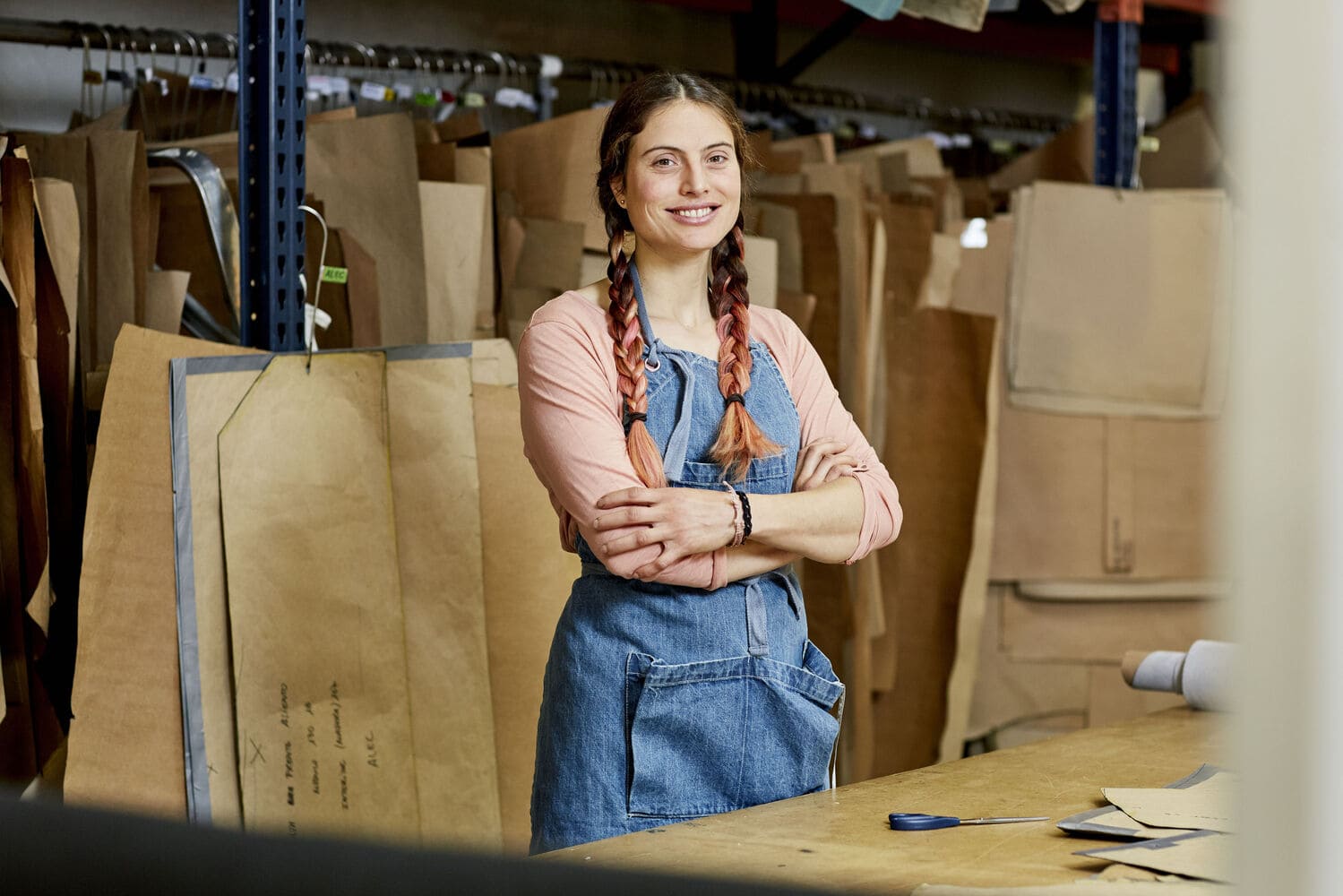 Woman in a textiles factory smiling