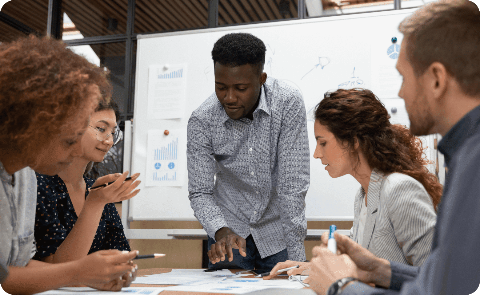 Group of workers with a whiteboard