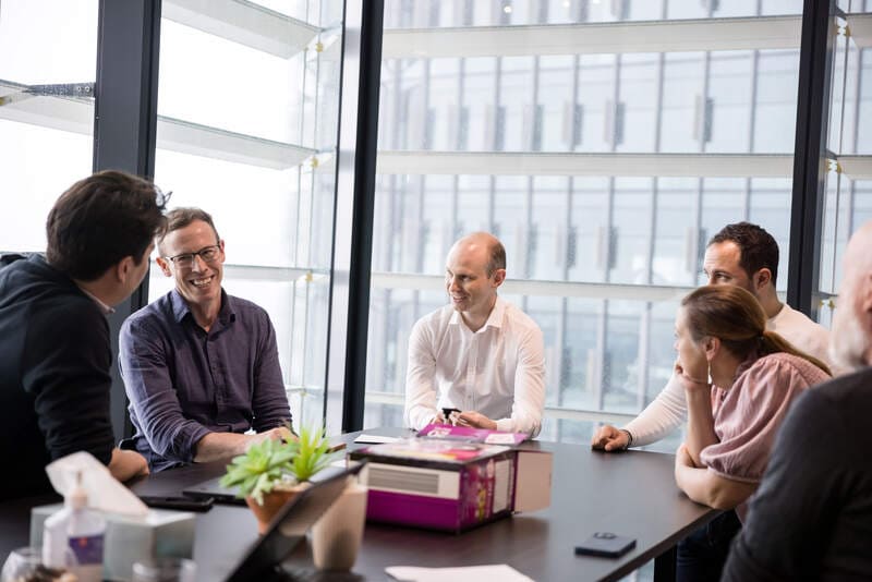 Wiise sales team sitting at a table